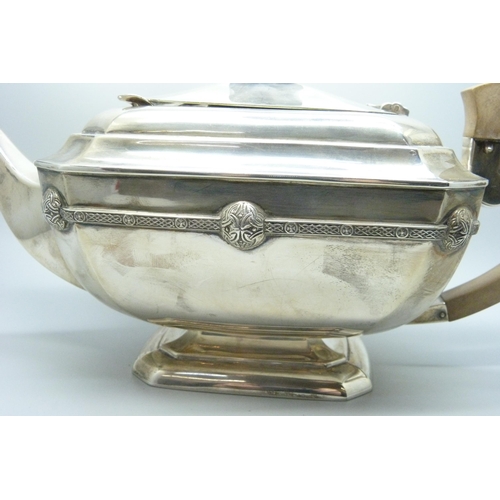 860 - A silver teapot and a silver spoon, 835g