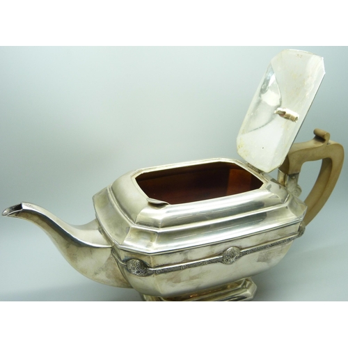 860 - A silver teapot and a silver spoon, 835g