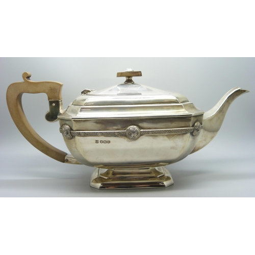 860 - A silver teapot and a silver spoon, 835g