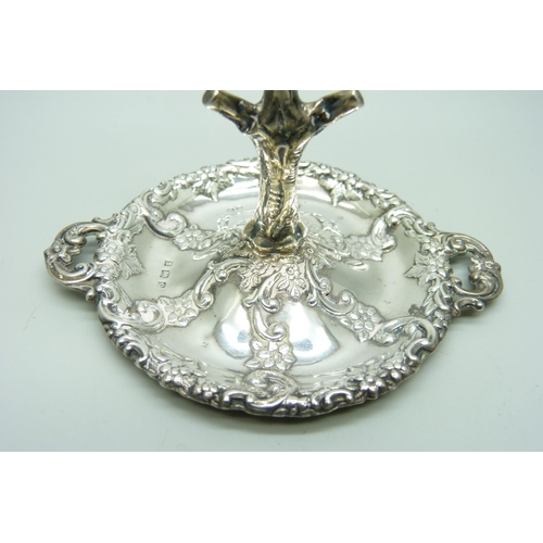 865 - An embossed silver ring stand, Birmingham 1902, 34g