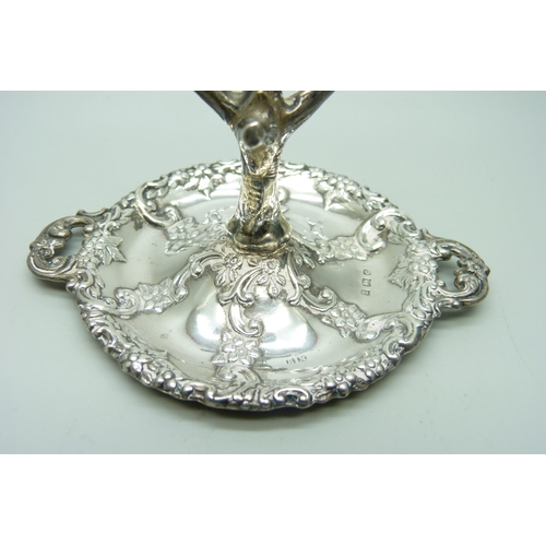 865 - An embossed silver ring stand, Birmingham 1902, 34g