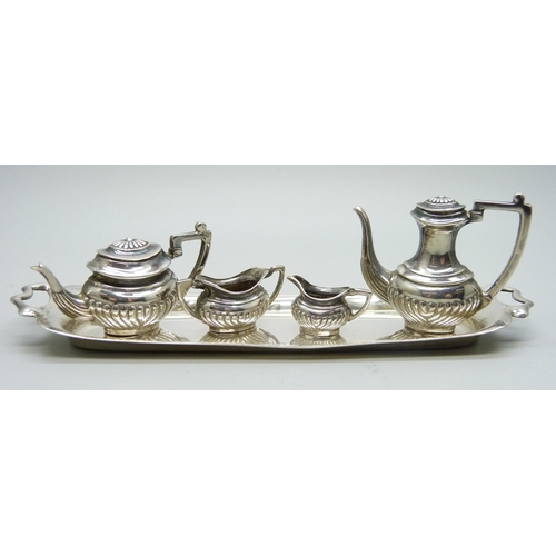 869 - A hallmarked silver miniature doll's house tea service and tray, 66g, tray 14.5cm