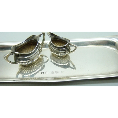 869 - A hallmarked silver miniature doll's house tea service and tray, 66g, tray 14.5cm