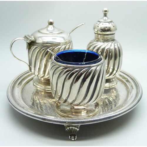 871 - A late Victorian three piece silver condiment set and a Victorian silver tray, 324g, tray 147mm