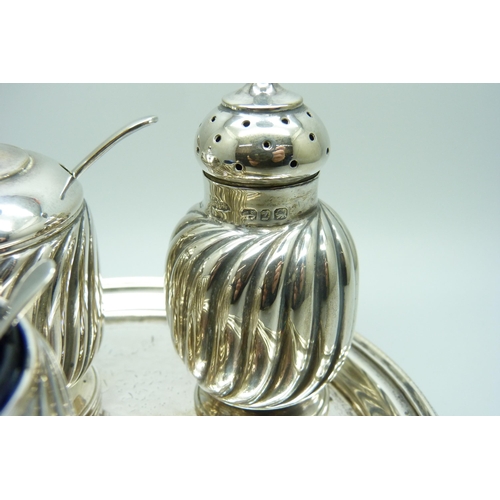 871 - A late Victorian three piece silver condiment set and a Victorian silver tray, 324g, tray 147mm