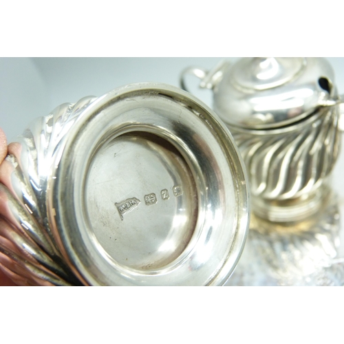 871 - A late Victorian three piece silver condiment set and a Victorian silver tray, 324g, tray 147mm