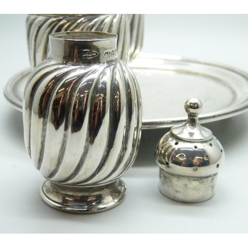 871 - A late Victorian three piece silver condiment set and a Victorian silver tray, 324g, tray 147mm