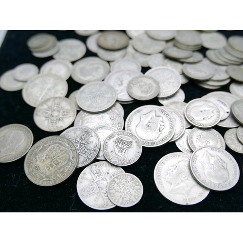 878 - A collection of half silver coins, 698g