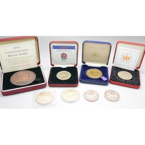 879 - A collection of coins including a 1995 bronze commemorative medal, a 2002 Queens Golden Jubilee meda... 