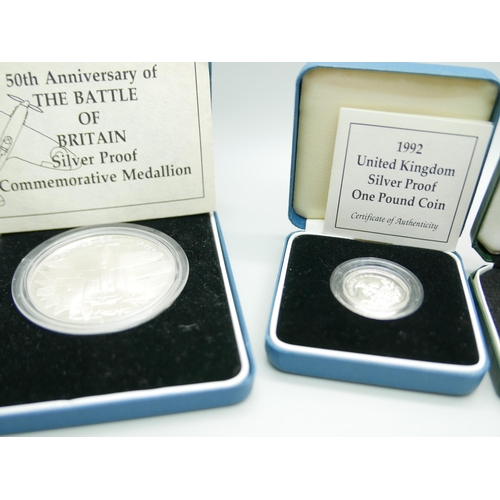 880 - Four Royal Mint silver coins; including National Trust and Battle of Britain commemorative, all boxe... 