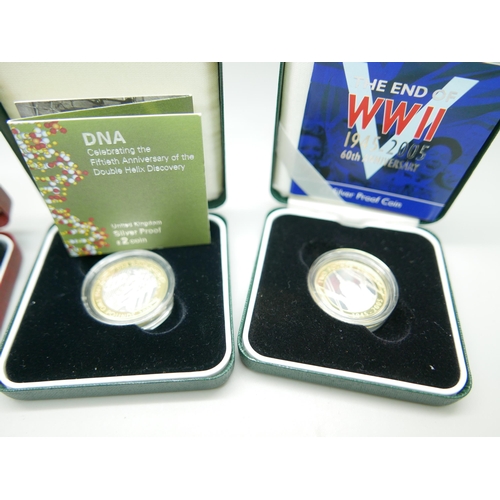 884 - Four silver proof coins including WWII 60th Anniversary and DNA Double Helix Discovery, with certifi... 