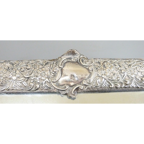 886 - A silver framed mirror, no back stand, 32cm wide, lacking small piece of silver from the top