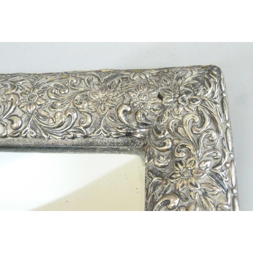 886 - A silver framed mirror, no back stand, 32cm wide, lacking small piece of silver from the top