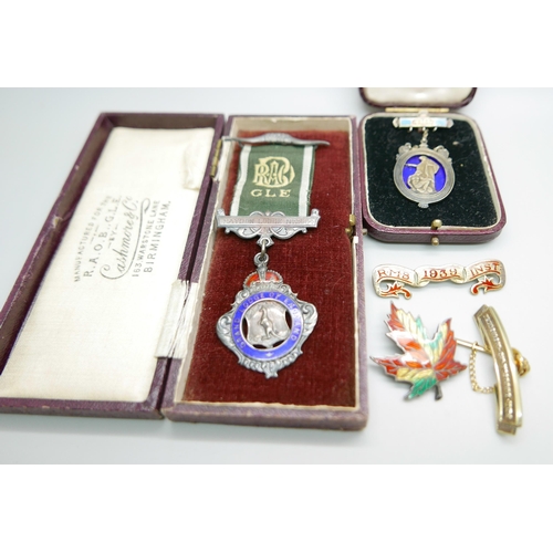 888 - A collection of silver including a lodge medal, brooch and badges