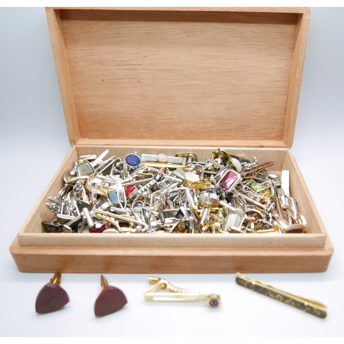 892 - A collection of cufflinks, approximately 52 pairs and 29 tie-pins