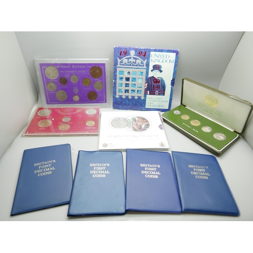 901 - A collection of coin sets including UK 1994, The Official UK Royal Wedding coin 2011 and Britains Fi... 