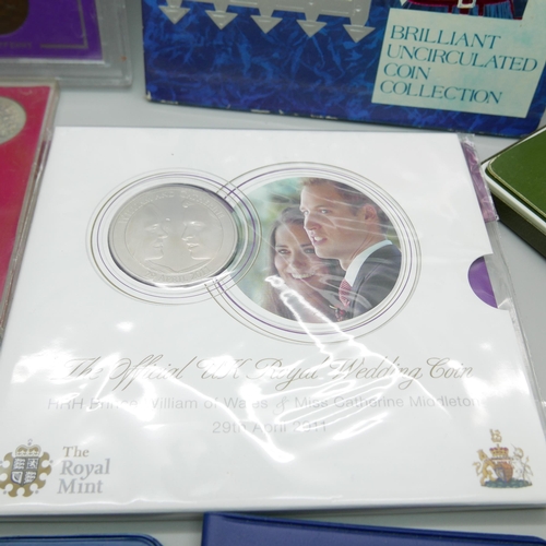 901 - A collection of coin sets including UK 1994, The Official UK Royal Wedding coin 2011 and Britains Fi... 