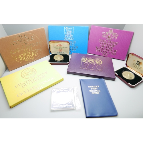 908 - A collection of five coin sets, a Britains First Decimal Coins pack and two proof crowns