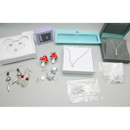 910 - A collection of silver jewellery including a designer Ted Baker necklace, includes Disney silver set... 