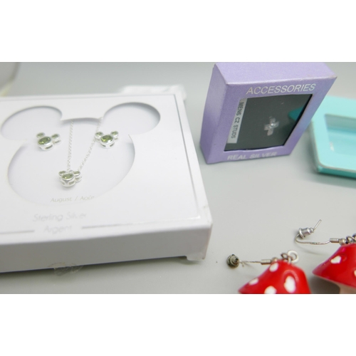 910 - A collection of silver jewellery including a designer Ted Baker necklace, includes Disney silver set... 