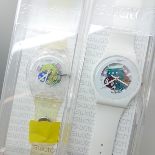 911 - Four Swatch wristwatches, boxed