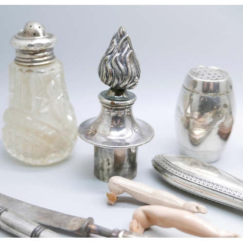 925 - A silver hand mirror, a silver mounted nail buffer, two nut crackers, jewellery, etc.