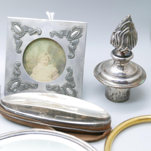 925 - A silver hand mirror, a silver mounted nail buffer, two nut crackers, jewellery, etc.