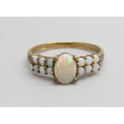 928 - A 9ct gold and opal ring, 1.6g, P