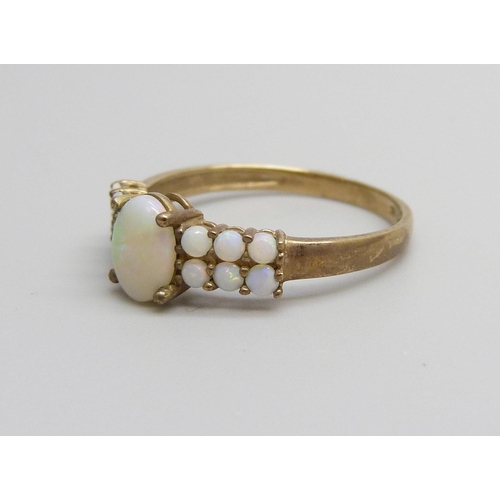 928 - A 9ct gold and opal ring, 1.6g, P