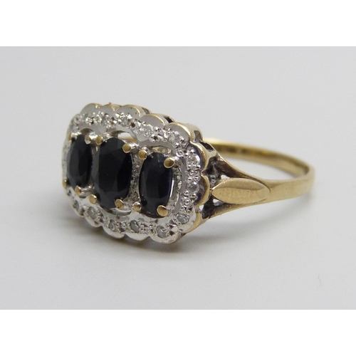 938 - A 9ct gold, diamond and sapphire ring, 2.7g, P