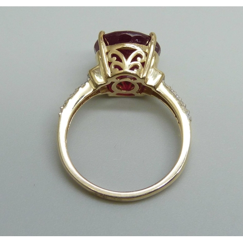 939 - A 9ct gold, diamond and synthetic ruby ring, 3.1g, K