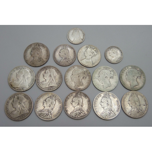 943 - A collection of fifteen Victorian silver coins, 11 half-crowns, 2 florins and 2 one shilling, 181.5g