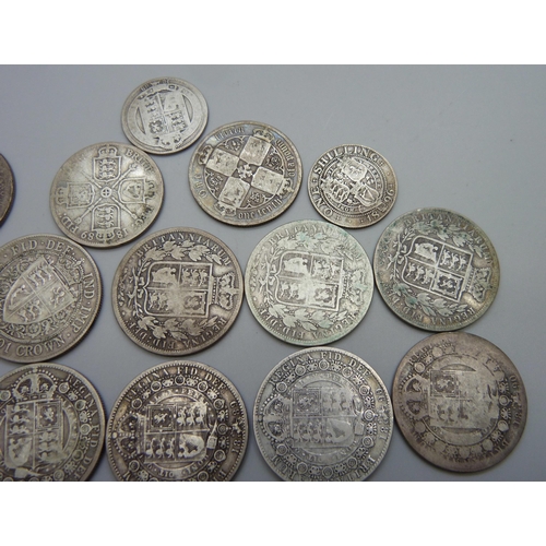 943 - A collection of fifteen Victorian silver coins, 11 half-crowns, 2 florins and 2 one shilling, 181.5g