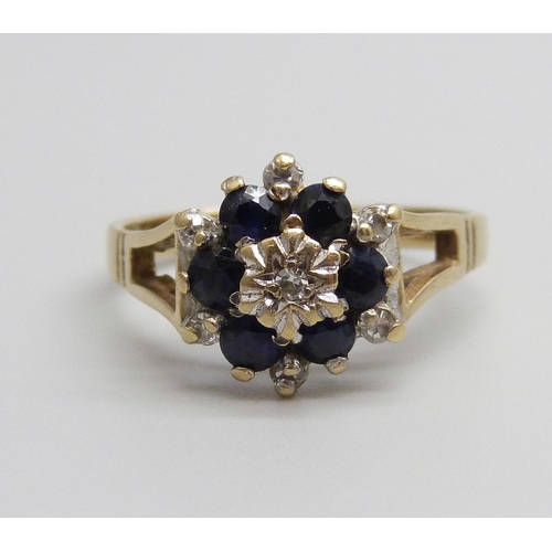 950 - A 9ct gold, diamond and sapphire ring, 2.2g, M