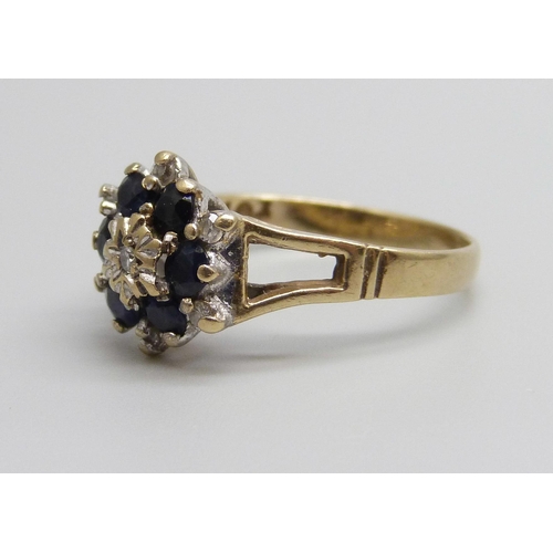 950 - A 9ct gold, diamond and sapphire ring, 2.2g, M