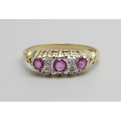 952 - A 9ct gold, ruby and diamond ring, 1.9g, S