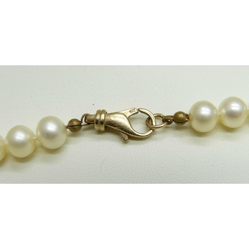 954 - A cultured pearl necklace, bracelet and two pairs of pearl earrings, all 9ct gold mounted, the pearl... 