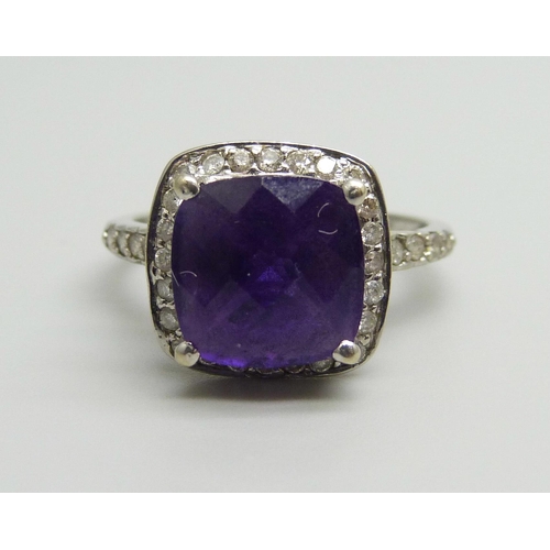 955 - A 14ct white gold, chequer cut amethyst and diamond ring, 3.9g, Q