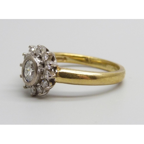 959 - An 18ct gold and diamond cluster ring, 0.50ct weight marked on the shank, 5.5g, P