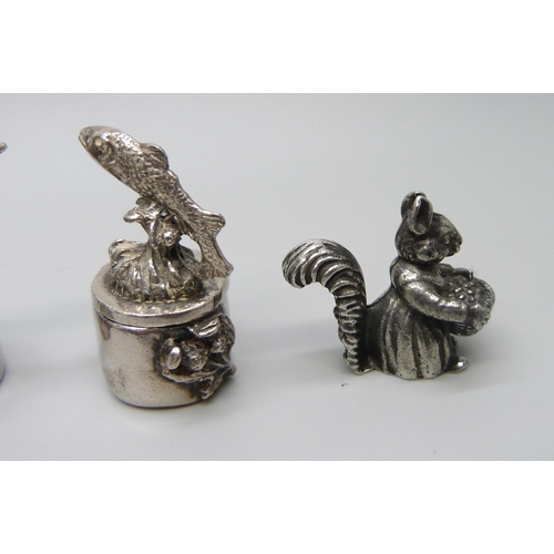 967 - A 925 silver dog rattle, four pill boxes including one mounted with a model fox, also a small novelt... 