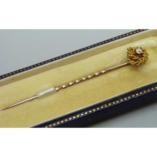 969 - A 15ct gold and diamond stick pin, cased, 1.5g