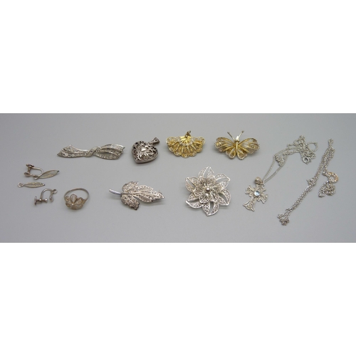 973 - A collection of silver and white metal jewellery including brooches, ring and pendants on chains