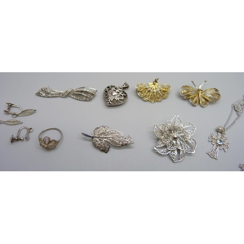 973 - A collection of silver and white metal jewellery including brooches, ring and pendants on chains