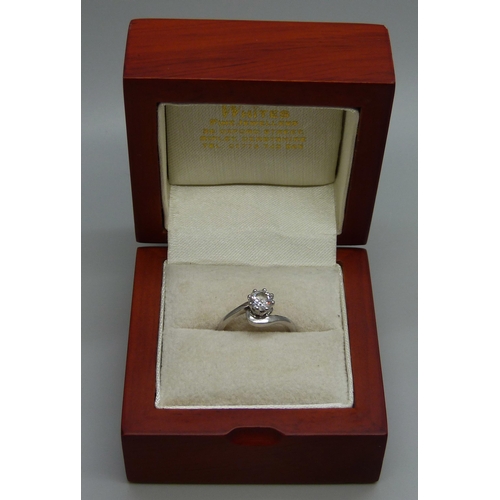 978 - A handmade platinum and diamond ring, full documentation and GIA diamond certification, 0.72ct weigh... 