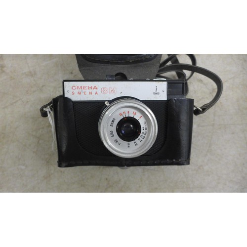 5077 - 2 Russian-made vintage cameras - a 1970s Lomo CMEHA, 8mm-35mm and a Zenit 12XP, 35mm camera, both in... 