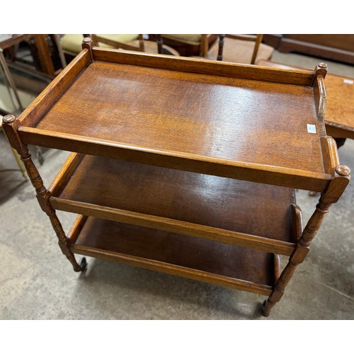 199 - An early 20th Century oak three tier tea trolley