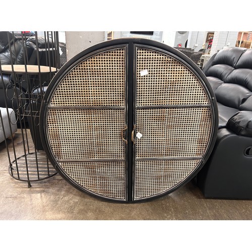 3159 - A circular wall cabinet with rattan design