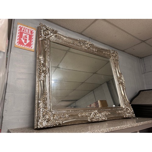 3155 - A large champagne ornate bevelled mirror