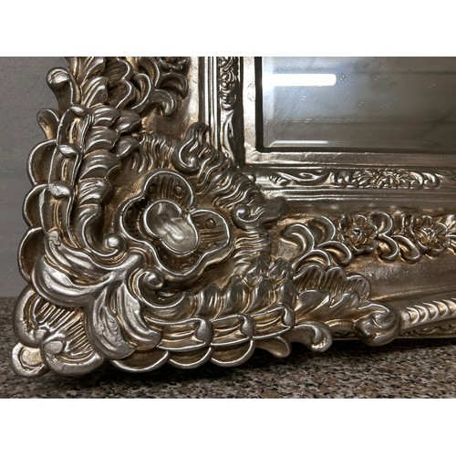 3155 - A large champagne ornate bevelled mirror