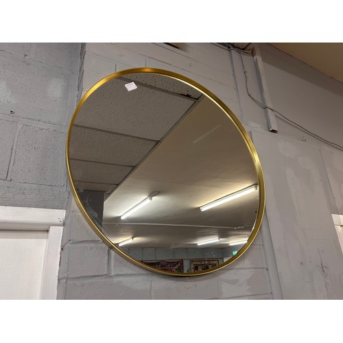 3075A - A gold circular mirror